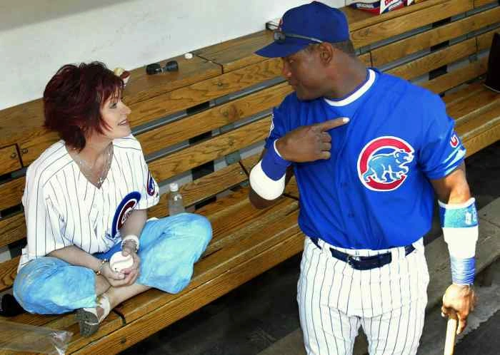 Sharon Osbourne chatting with Sammy Sosa in the dugot. 2003