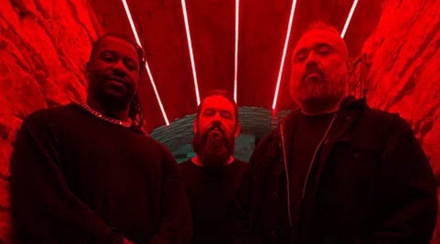 ANIMALS AS LEADERS Join Joe Satriani & Steve Vai’s ‘Satchvai Band’ Tour This Spring The Mosh Network - Animals As Leaders group photo featuring all three members in a red lit room