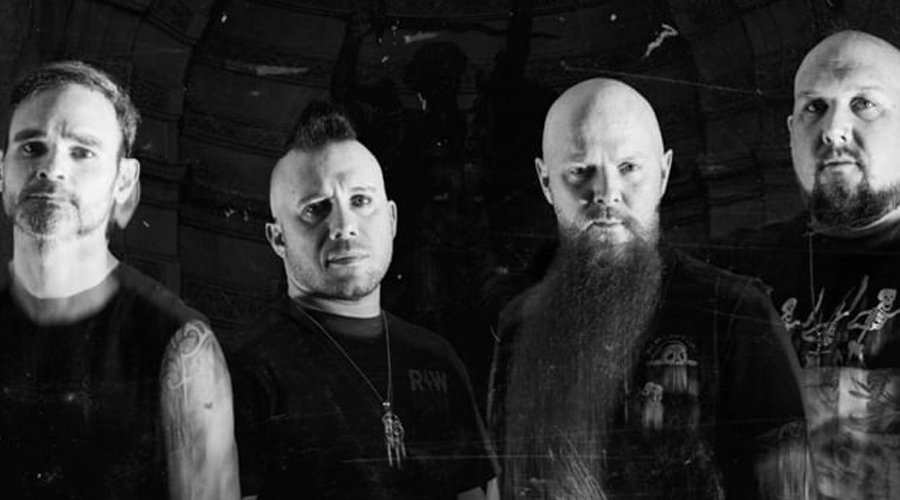 ATREYU Re-Record ‘The Curse’ With Current Lineup, Vinyl Pre-Orders Available The Mosh Network - Black and white photo of the four current members of Atreyu, notably without former frontman Alex Varkatzas.