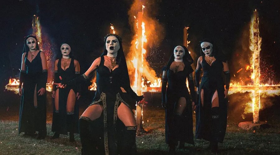 DOGMA’s Australian Tour Postponed Amid Backlash Over Management Practices The Mosh Network - Dogma promoional photo 2025 featuring burning crosses