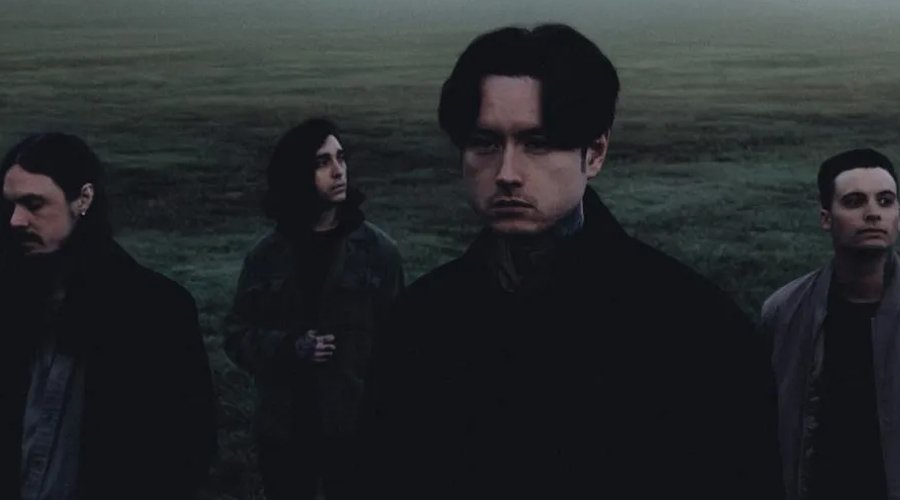 BAD OMENS, BEARTOOTH & PRESIDENT Announce Spring 2026 North American Arena Tour The Mosh Network - Bad Omens promotional photo 2025 featuring the band in a dark field