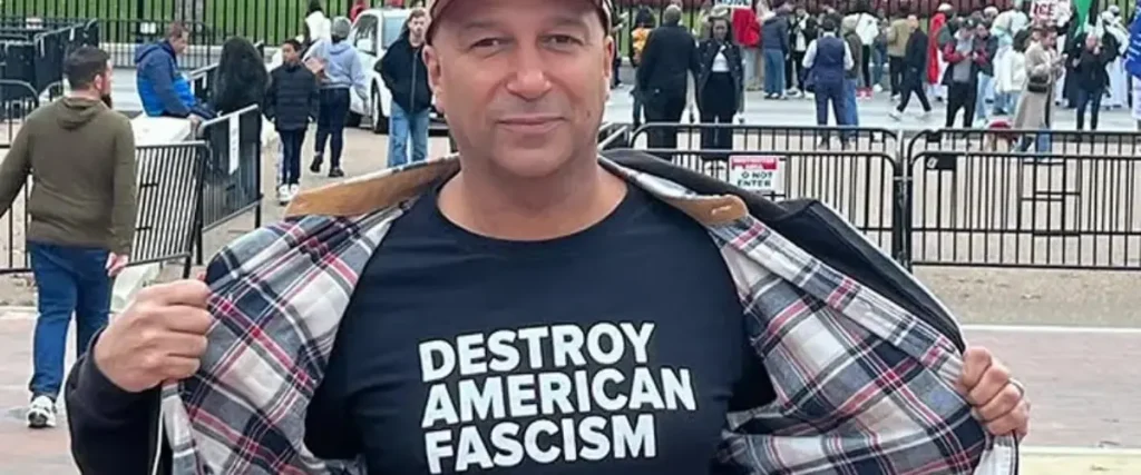 Tom Morello Criticizes Trump Administration Over Alleged Nazi-Era Slogan Usage The Mosh Network - Tom Morello sporting his new "Destroy American Fascism" merch in front of the White House.