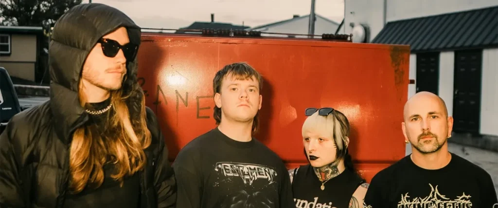 No Cure Debut “Slowly Turning Blue” Video The Mosh Network - No Cure band 2026